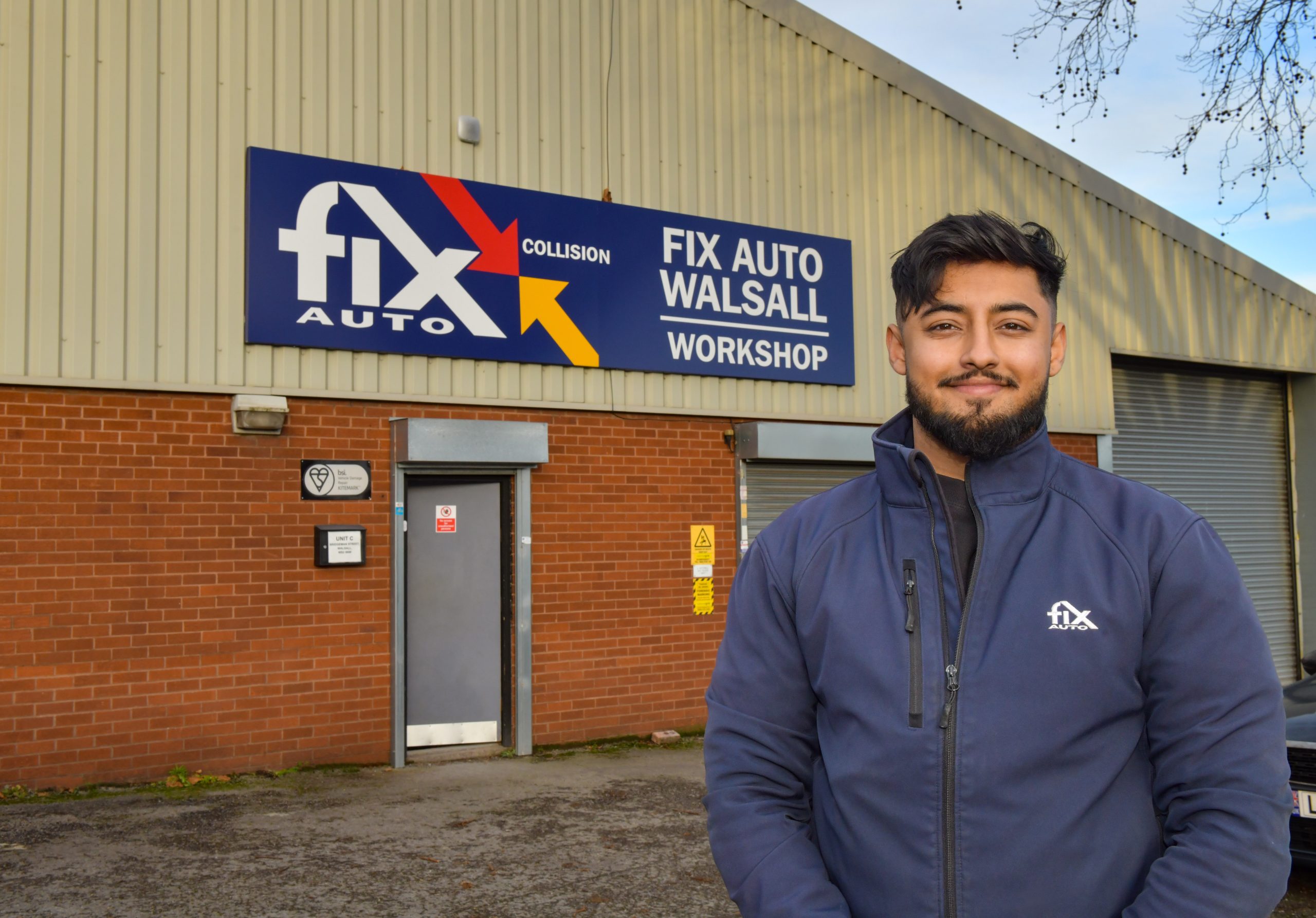 Standing proud… Humam Amin, Director and Bodyshop Manager at Fix Auto Walsall, in front of the repairer’s new 12,000 sq ft unit that ‘elevates’ the business to another level both in terms of repair capacity.