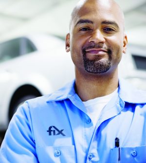 Mechanic in auto repair shop, portrait